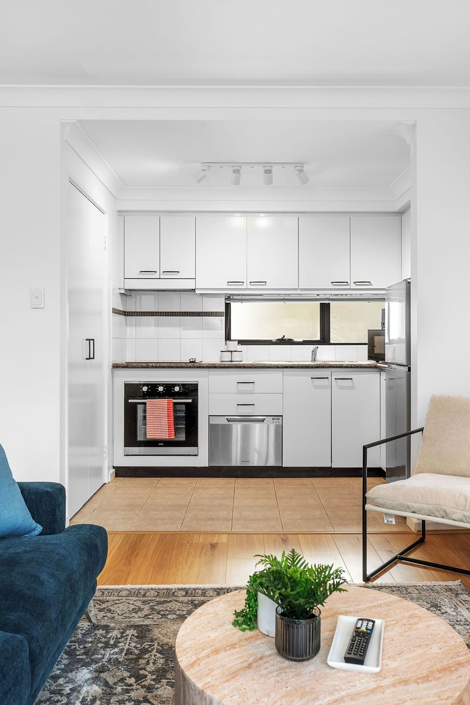 Enjoy the convenience of a bright and efficient kitchen, complete with modern appliances including an oven and dishwasher.