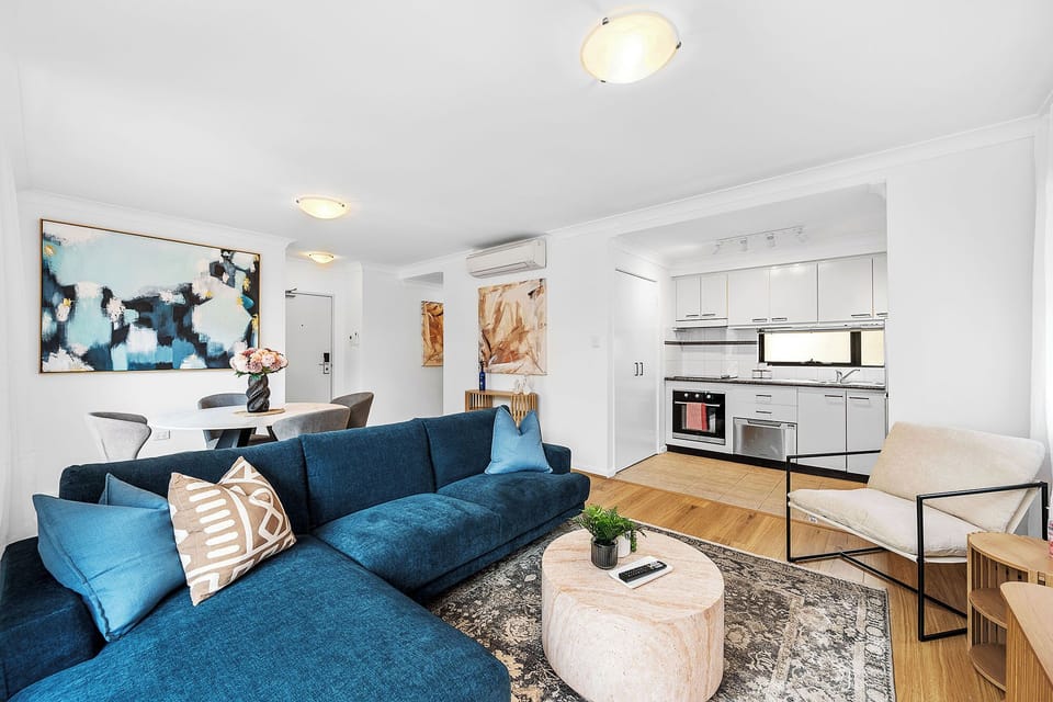 Unwind in this thoughtfully designed living space, offering both comfort and functionality. The open connection to the kitchen makes dining and entertaining a breeze.