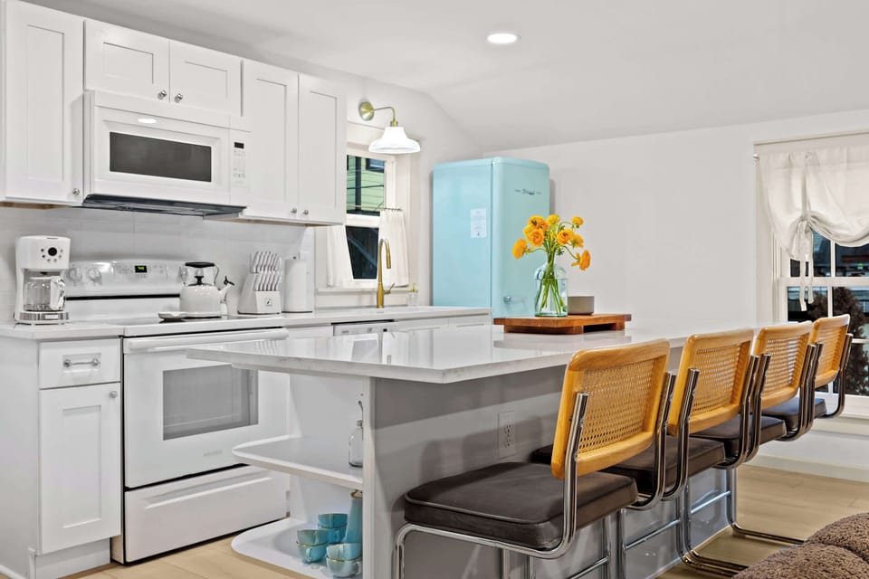 Dining Area: Brighten your stay with a fresh start in this thoughtfully designed kitchen and dining space.