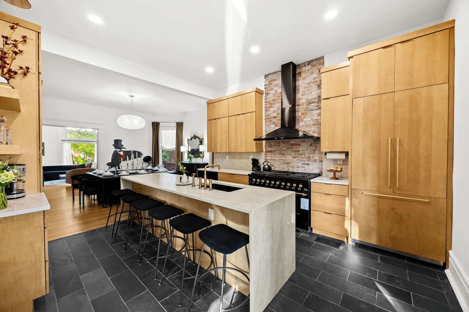 Kitchen: From morning coffee to gourmet meals, this beautiful kitchen with its striking backsplash is ready for your culinary adventures.