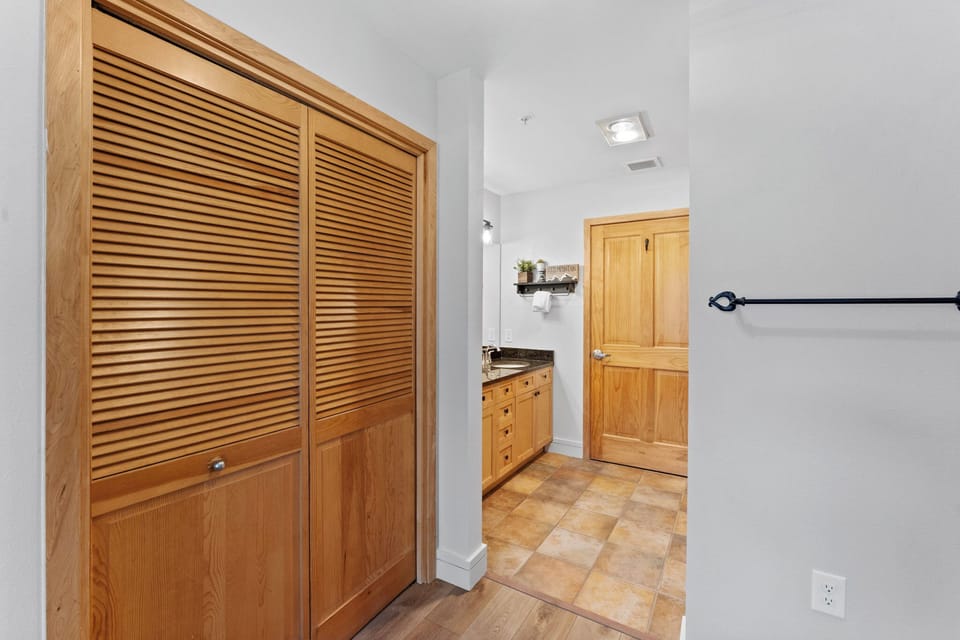 You'll love the beautiful wood-paneled closets and open-concept flow to your fully equipped kitchen—perfect for storing all your vacation essentials.