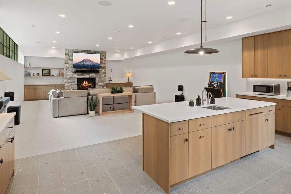 Lower Level Entertainment lounge with fireplace, second kitchen, dishwasher, two polycade arcades
