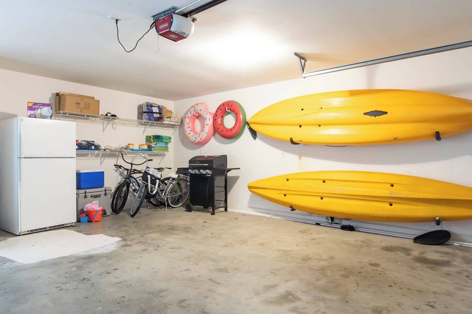 Fully stocked garage with kayaks, bikes, beach toys, coolers and an extra fridge