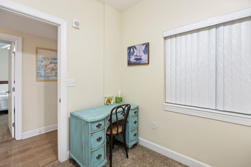 Waterway Stay - Unit 309 at Harbour Pointe - Den offers a vintage writing desk and a futon for an extra sleep spot of needed.