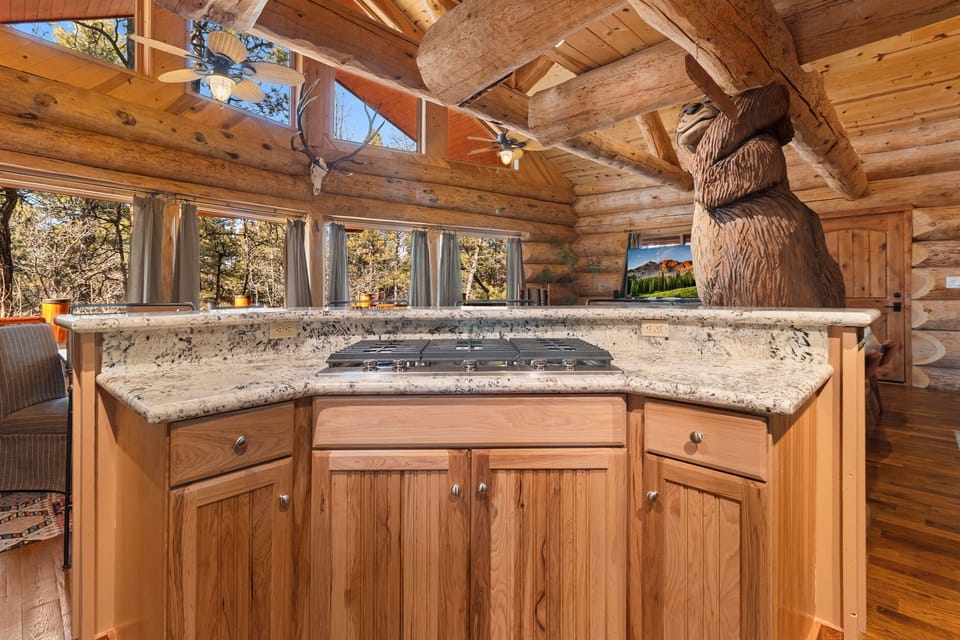 Warm and inviting gathering space with one-of-a-kind custom log details