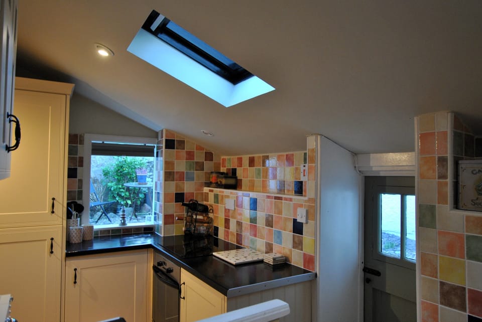 The kitchen gives access to the small courtyard