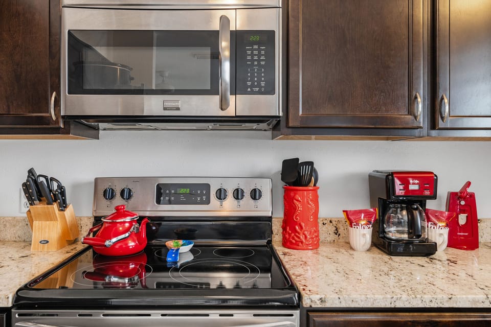 Coffee ready, stove set, vacation mode on. This kitchen has all the comforts of home.