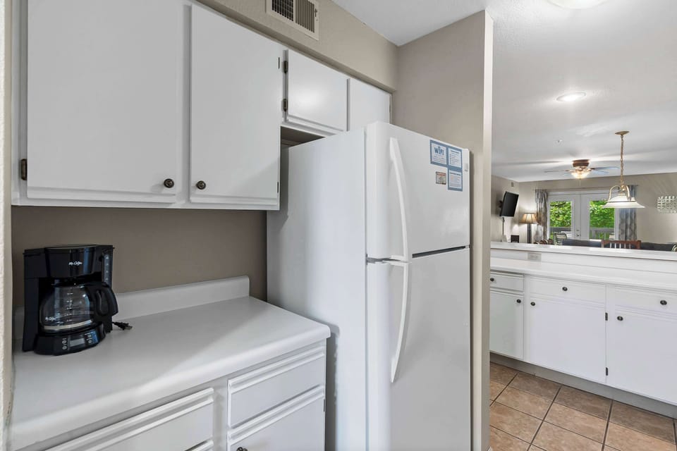 The open, airy kitchen offers ample space & all the comforts of home