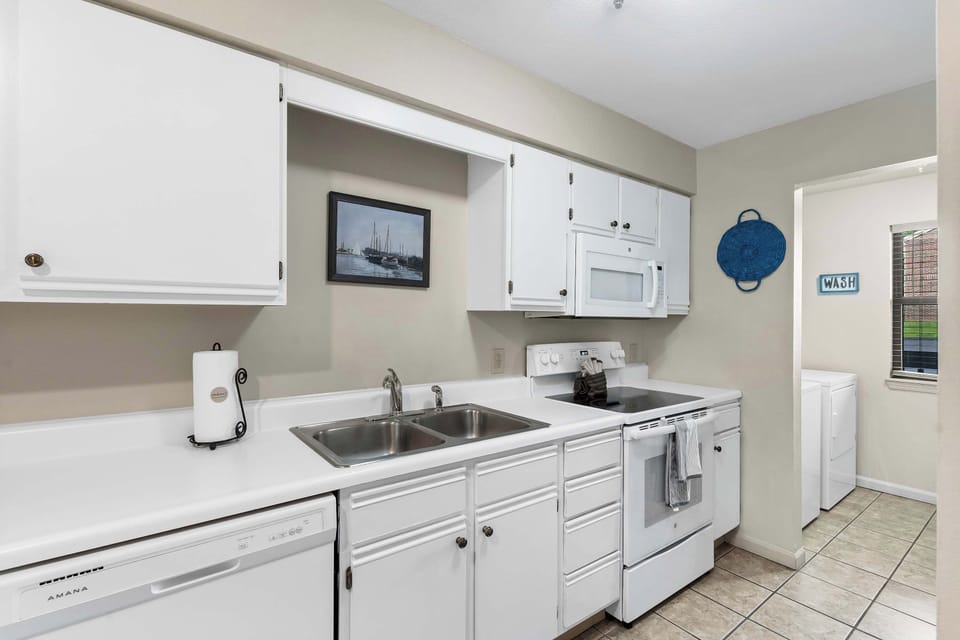 The open, airy kitchen offers ample space & all the comforts of home