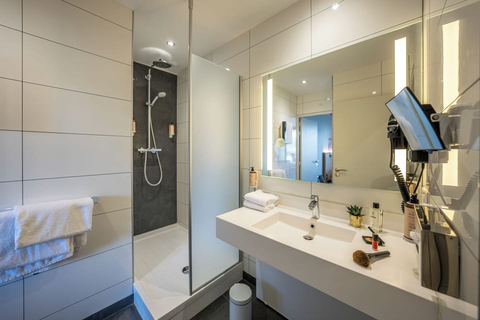 Eco-friendly toiletries, hair dryer, towels