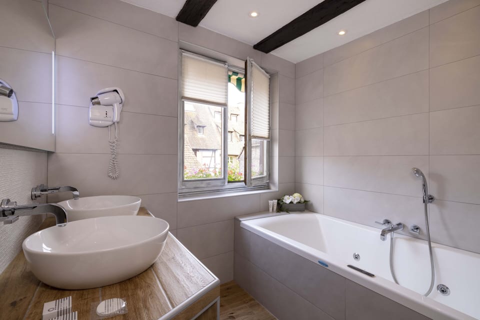 Romantic Suite, Jetted Tub (for 2) | Bathroom | Designer toiletries, hair dryer, bathrobes, slippers