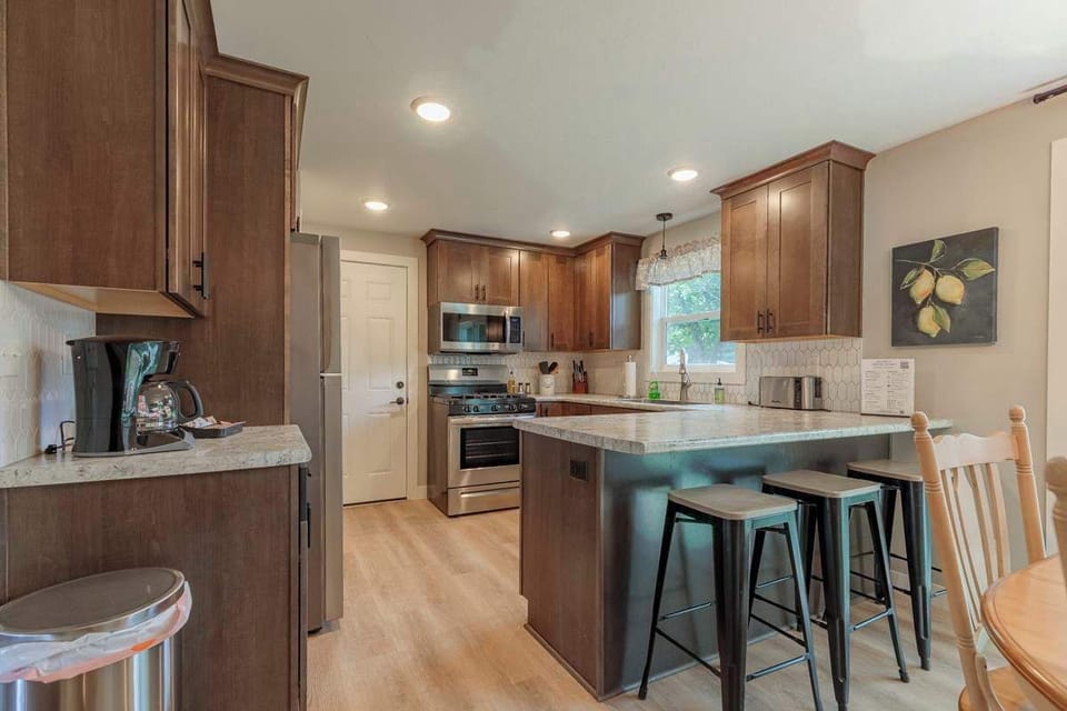 Modern, fully equipped kitchen with ample counter space and storage—perfect for preparing meals and gathering with family and friends.