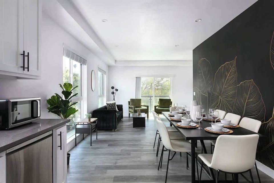 Modern kitchen with sleek appliances and ample counter space

