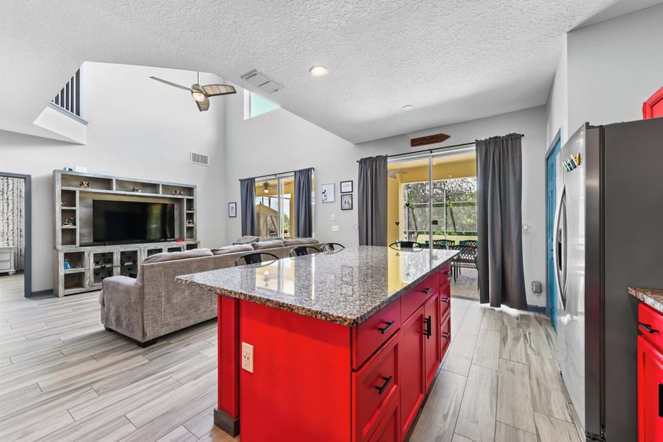 KITCHEN:  Overlooking Rear Living Room with Direct Access to Patio 