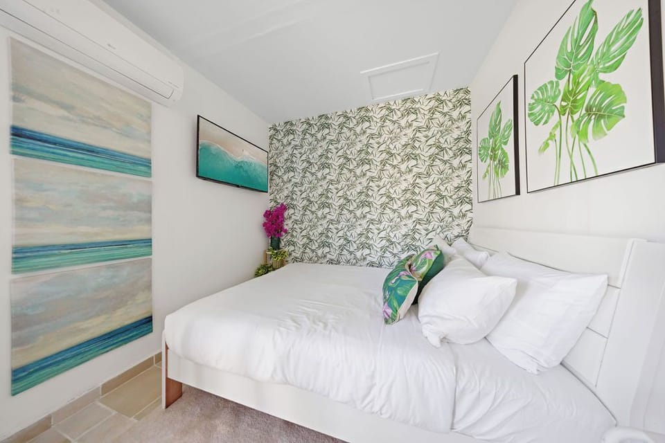 Bright and modern open-plan studio with a comfy queen-size bed, Smart TV, and inviting ambiance—perfect for a relaxing island stay.