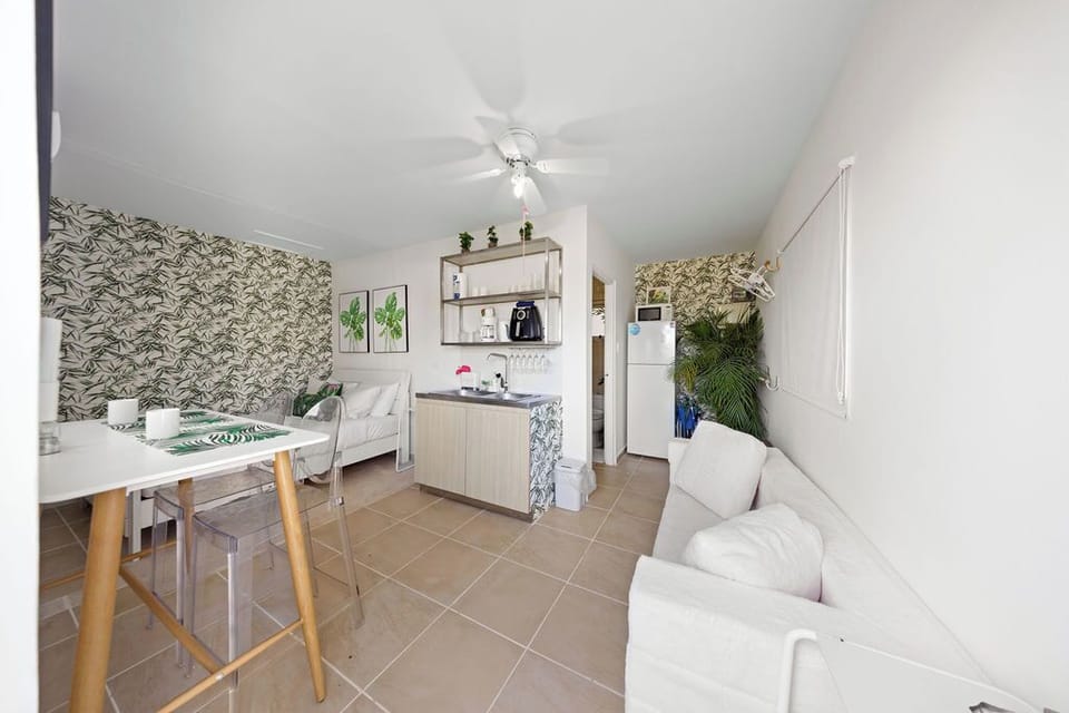 Bright and modern open-plan studio with a comfy queen-size bed, Smart TV, and inviting ambiance—perfect for a relaxing island stay.