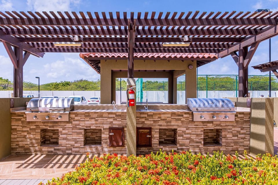 Take dining to the next level with the condos' shared BBQ grill and fully-equipped kitchen, perfect for hosting a memorable cookout or preparing delicious meals in a relaxing outdoor setting.