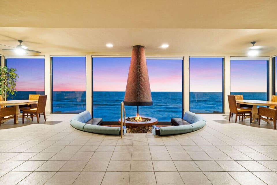 Oceanfront condo perks: cozy lounge, firepit, and sunset views 🌅🔥