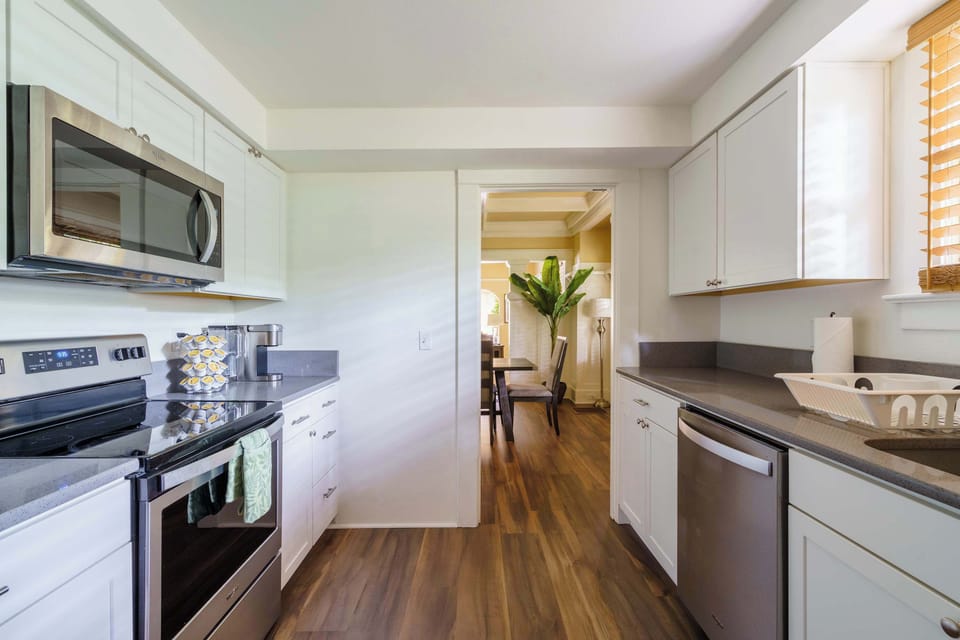 Kitchen with sink and dining room view.