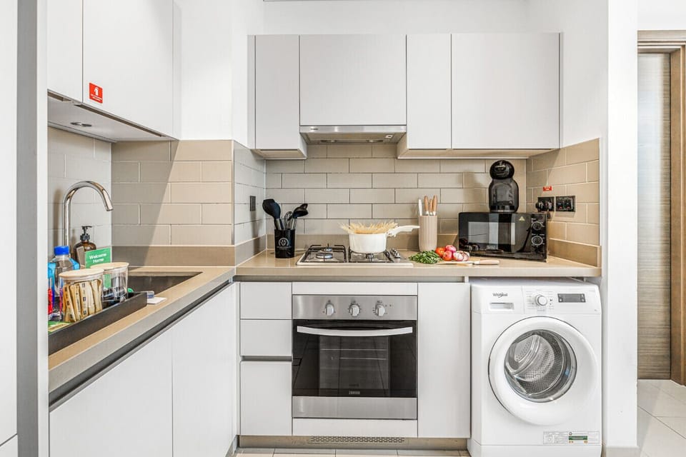 A modern, fully equipped kitchen designed for both functionality and style