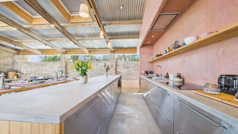 Fully equipped for self-catering with premium integrated appliances and vast workspace.