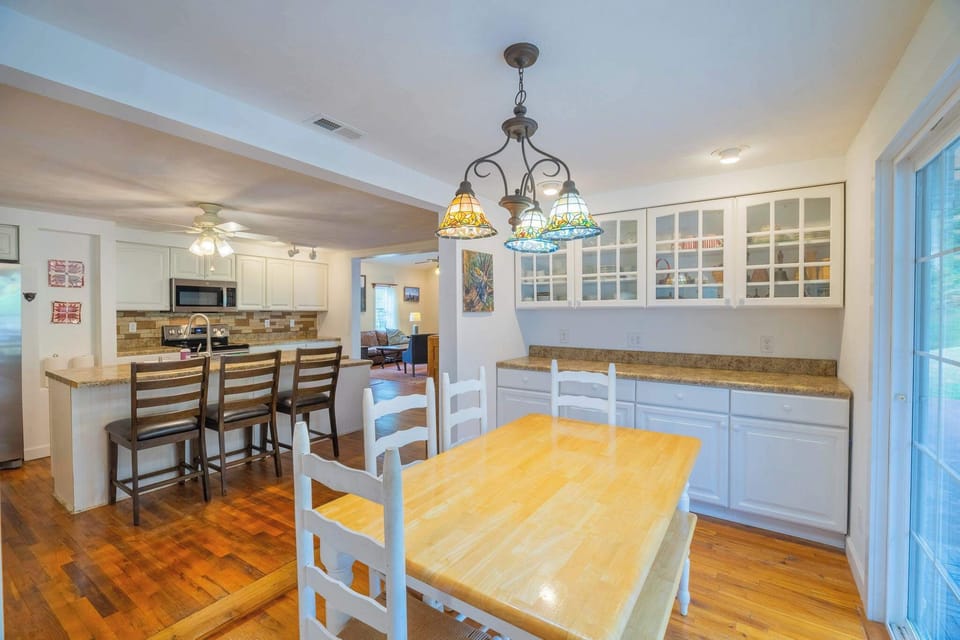 Welcome inside!  You will see the eat in kitchen immediately on your left.  We have bar seating for three and table seating for six or seven depending on how you utilize the bench.