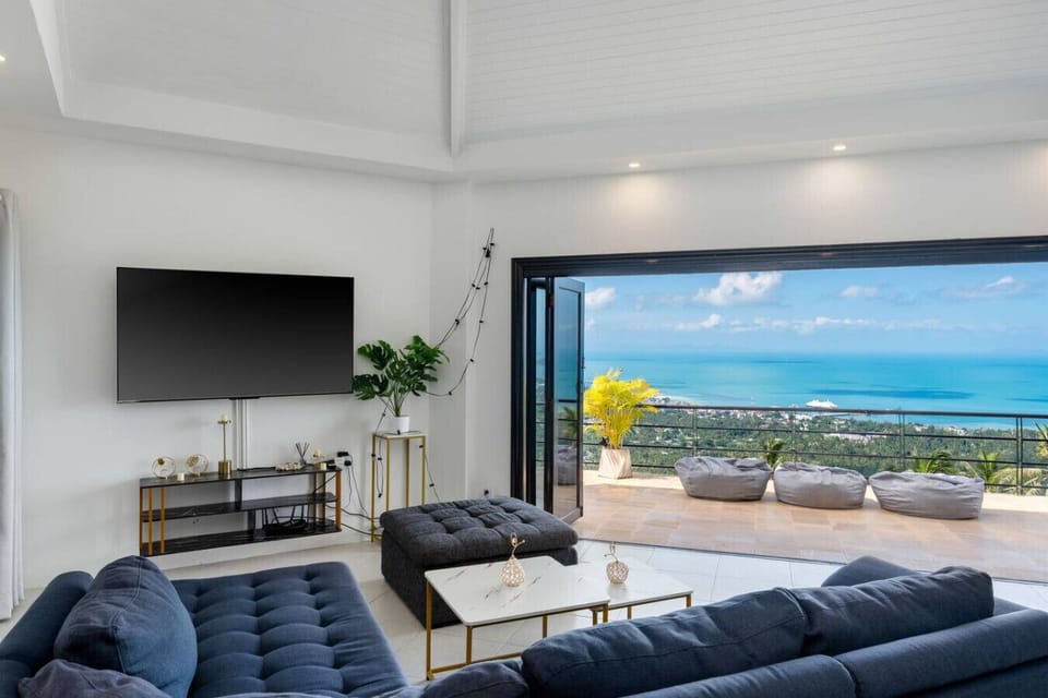 Spacious living room with ocean view and modern sofa at Villa SKY, Nathon Koh Samui