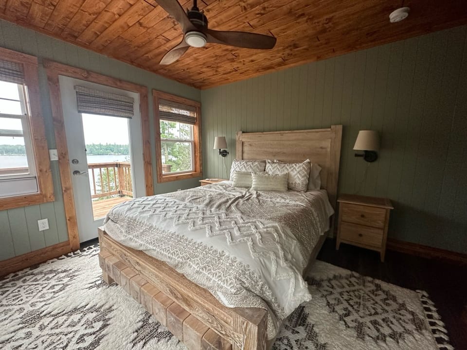 Upper Queen Bedroom - Queen Bedroom upstairs with windows overlooking the lake and private deck.