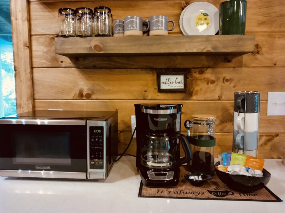 Every detail adds to your comfort! Enjoy this cozy nook which features coffee, tea, and a microwave.