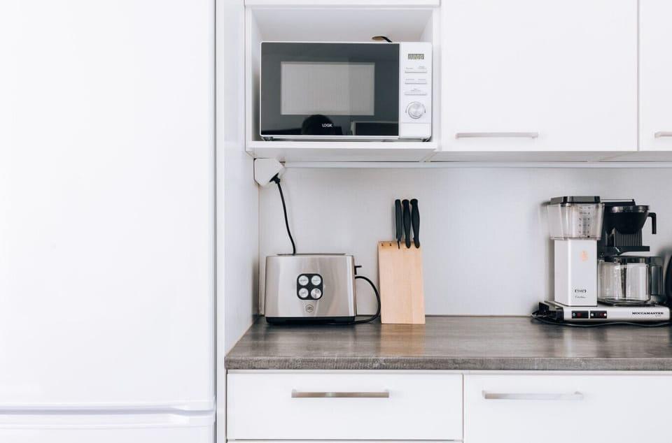 The apartment`s kitchen is well-equipped and includes an oven, full-size fridge-freezer, stove, and dishwasher.