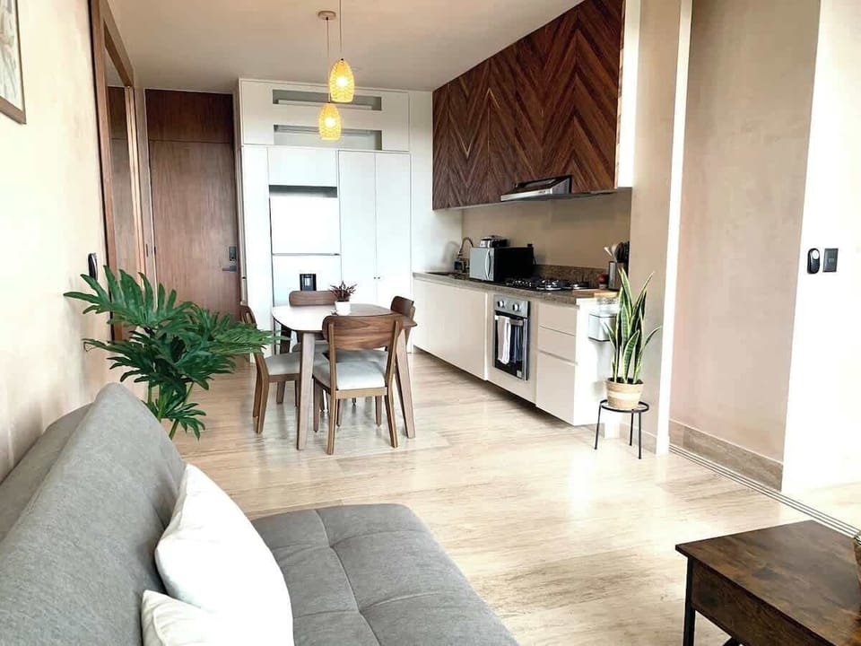 Open-plan living and kitchen area with smart TV