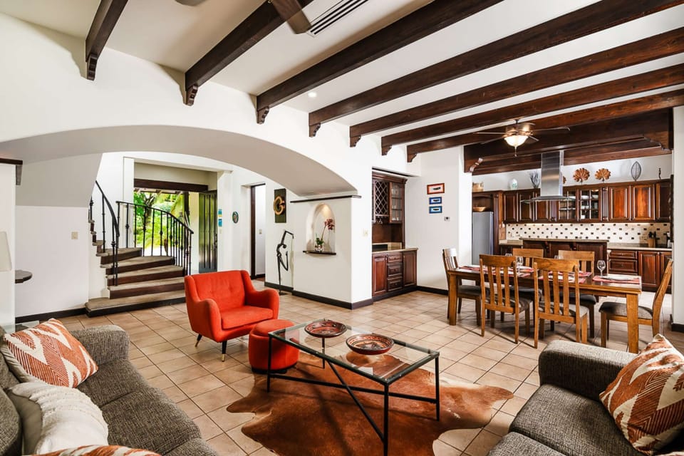 Living and dining room view + full kitchen