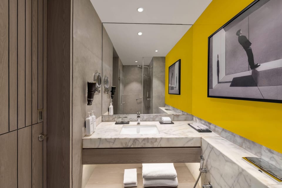 Eco-friendly toiletries, hair dryer, slippers, towels
