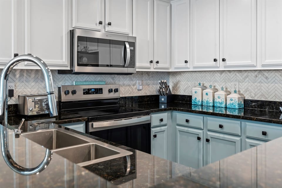 Full kitchen with stainless steel appliances