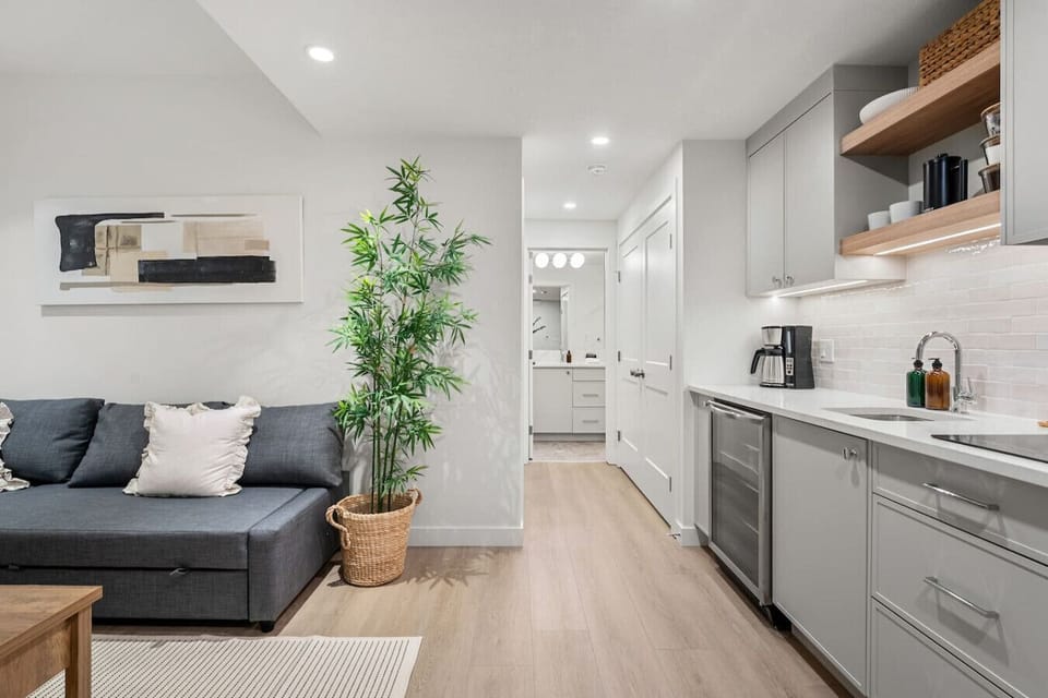 Living room with a Smart TV and a cozy sectional with a pull-out sleep sofa (all bedding provided!)