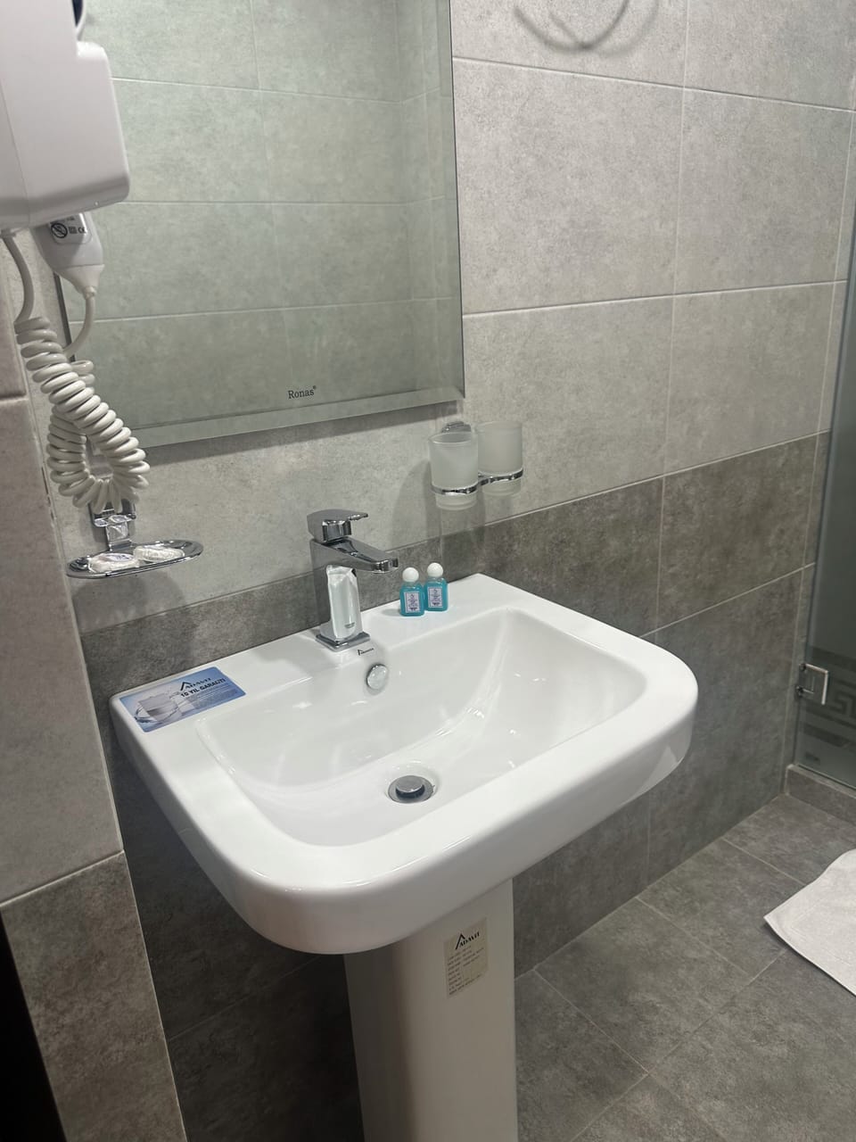 Hair dryer, towels, soap, shampoo