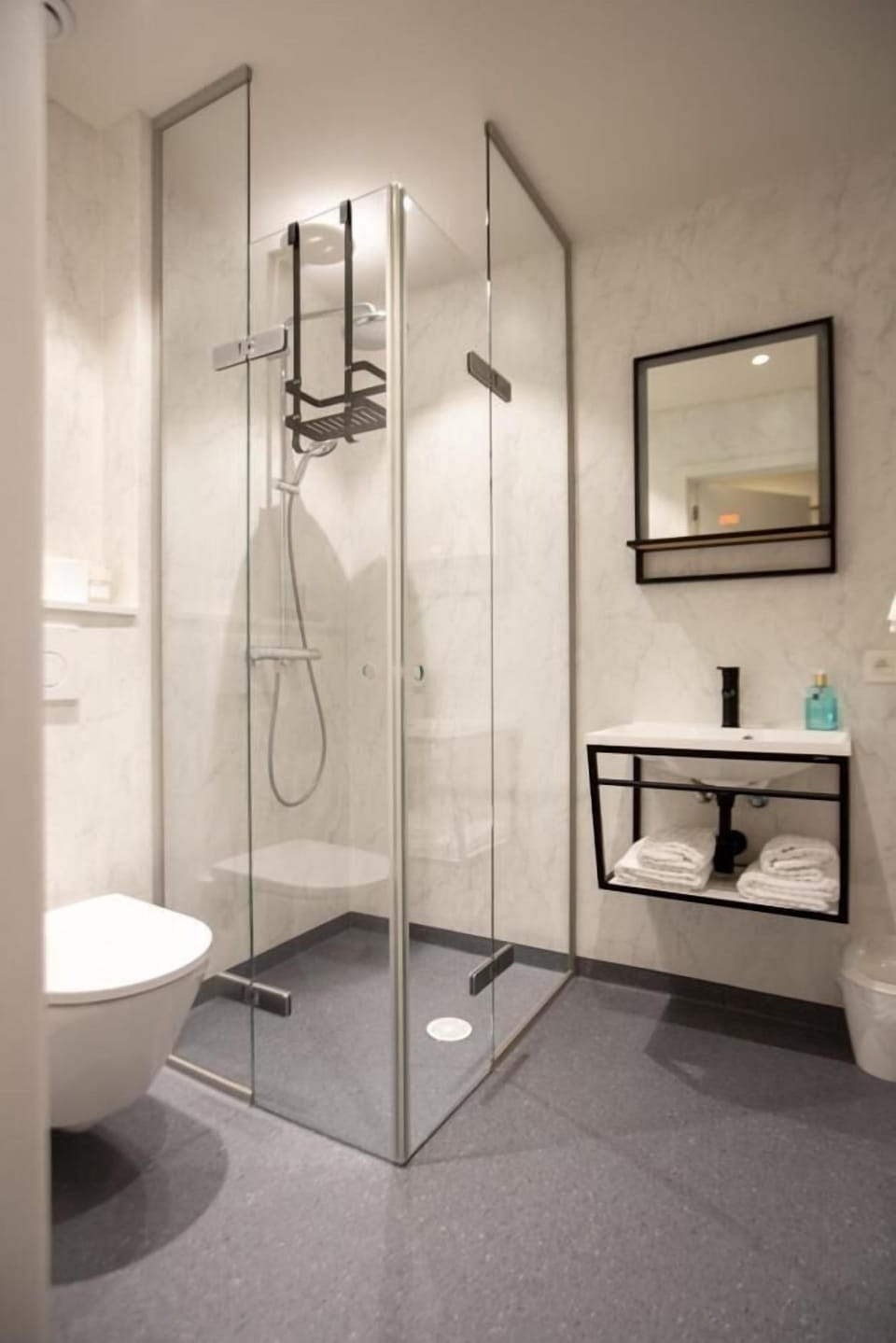 Rainfall showerhead, eco-friendly toiletries, towels