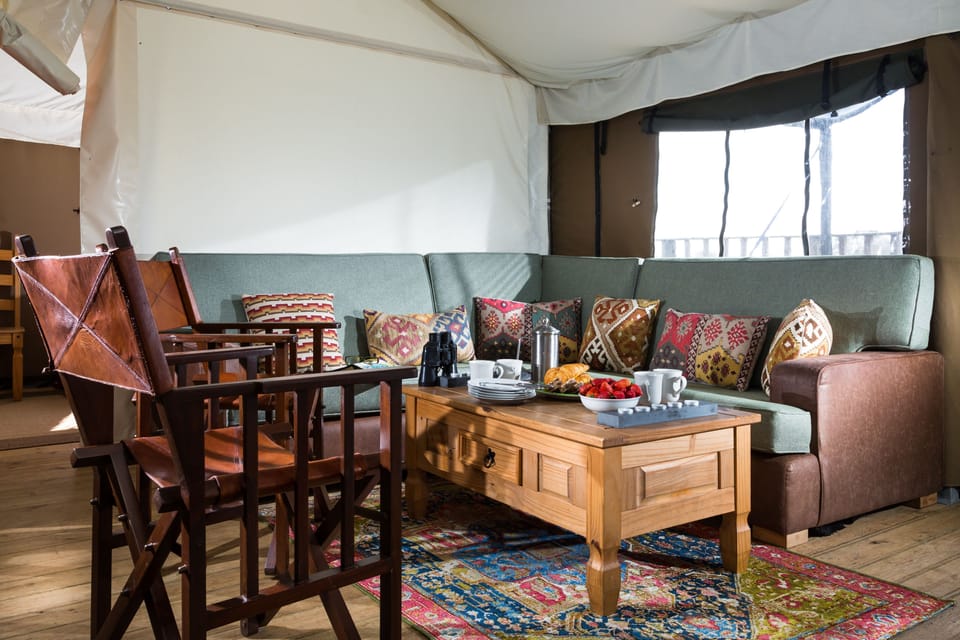 Living room with a six-seater sofa and two individual chairs