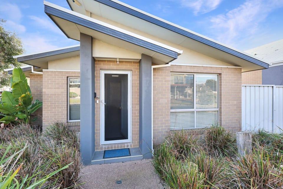 Welcoming front entrance with landscaped garden