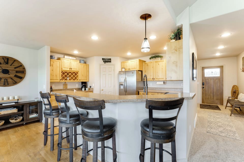 Kitchen with bar seating for four people | Main Level