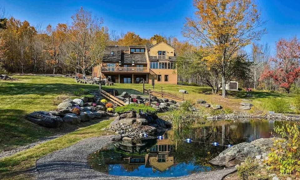 The Natural Swimming Pond,  featuring peastone beach area for entry exit and a waterfall feature.  Your own private mountain oasis for your next getaway, event or retreat!