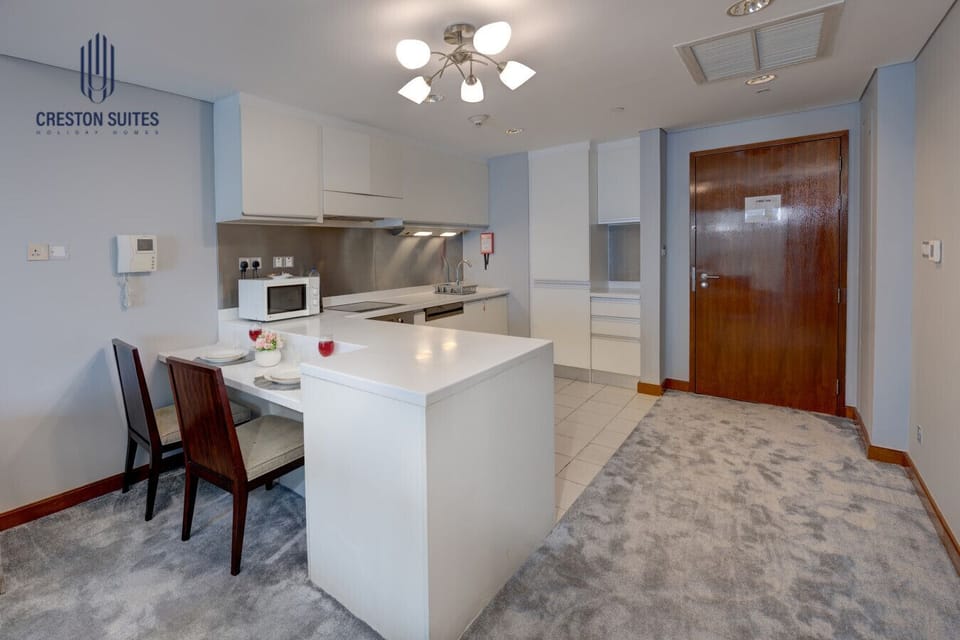 The kitchen and dining area layout and furnishings may vary slightly between rooms, yet each offers a stylish, comfortable, and well-appointed setting for your stay