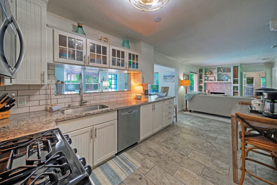 Coastal-inspired kitchen with stainless steel appliances, ample counter space, and everything you need for easy meals at home.