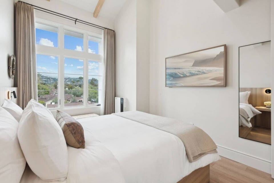 Queen-size bed, sleeps 2, seating area, and 65" Hisense TV 