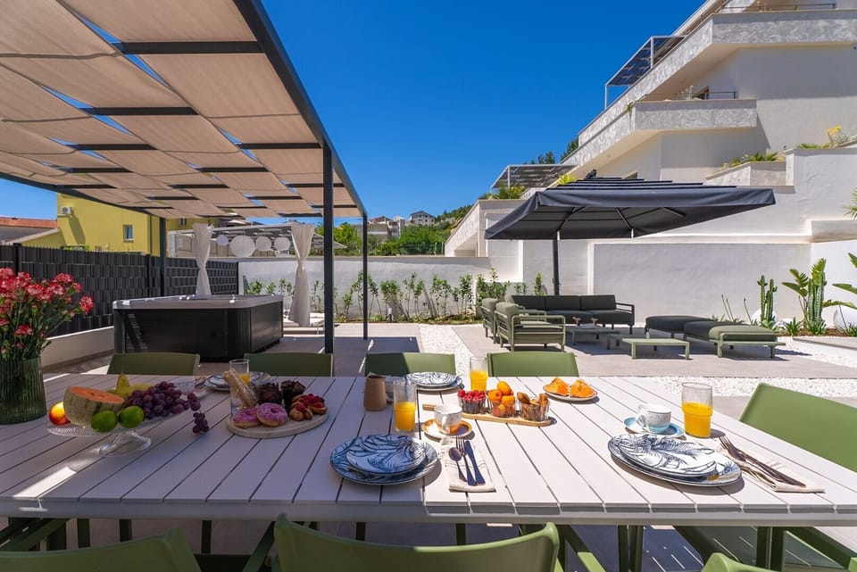 Complete with a luxurious Whirlpool (a Hot tub), sun loungers, and a covered outdoor dining space for up to 10 guests. 