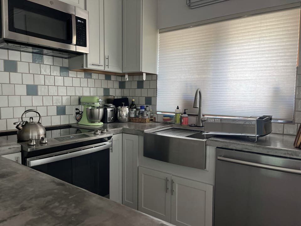Kitchen is well stocked for cooking and serving with all new appliances