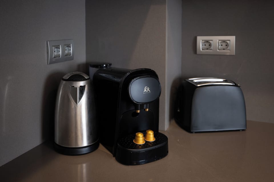 Apartment (1 Bedroom) | Private kitchen | Microwave, stovetop, coffee/tea maker, electric kettle