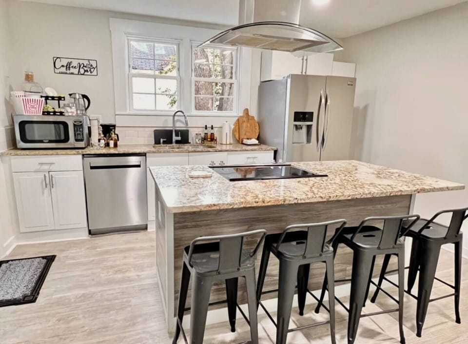 Super functional kitchen, with coffee bar, dishwasher, electric high end range, refrigerator with water and ice.