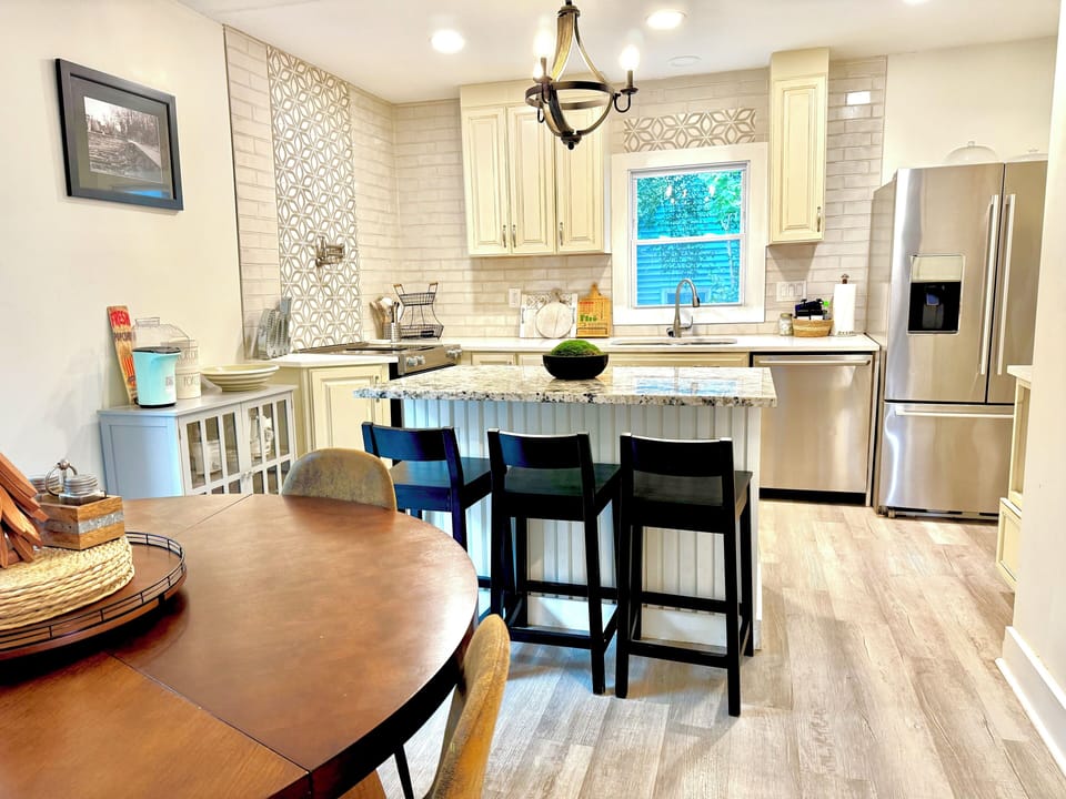 Our kitchen while small, is very practical and easy to use and has all the major appliances: Refrigerator, Range/Oven, Dishwasher, Microwave, even a water faucet by the range to fill pots with ease. 
A popcorn machine is waiting for you.