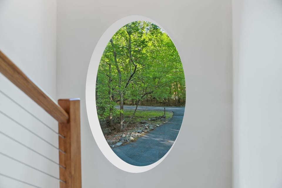 Signature window framing peaceful mountain views.